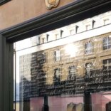 A shopping window embellished with lettering crafted from signage vinyl, showcasing brand names, promotions, or messages in a visually striking and attention-grabbing manner.